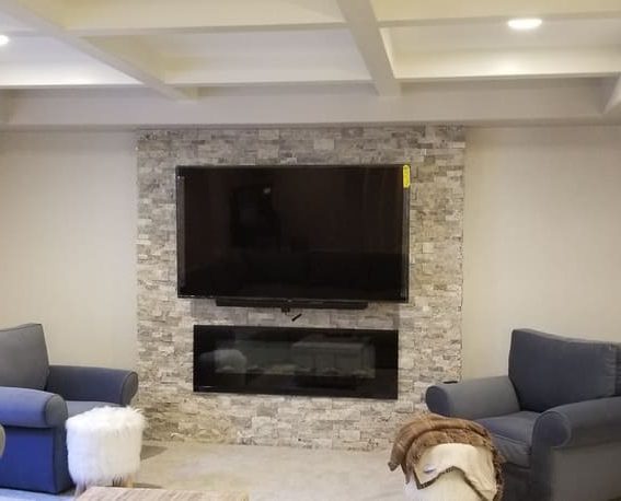 TV over fireplace. Basement Remodeling. Johnson County Remodeling.